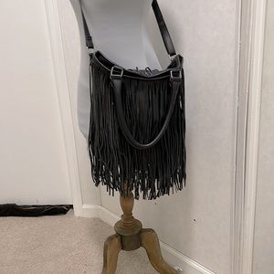 Black Boho purse. Shoulder Straps and Arm handles. Mossimo brand. Snap closure.